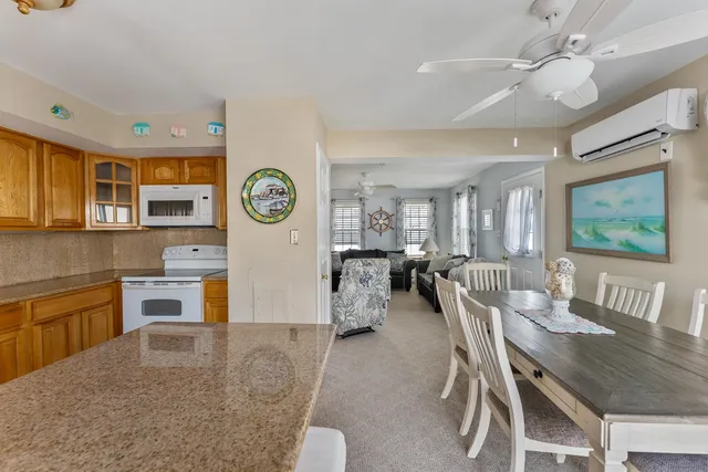 a bedroom with a bed and a large window with outer view