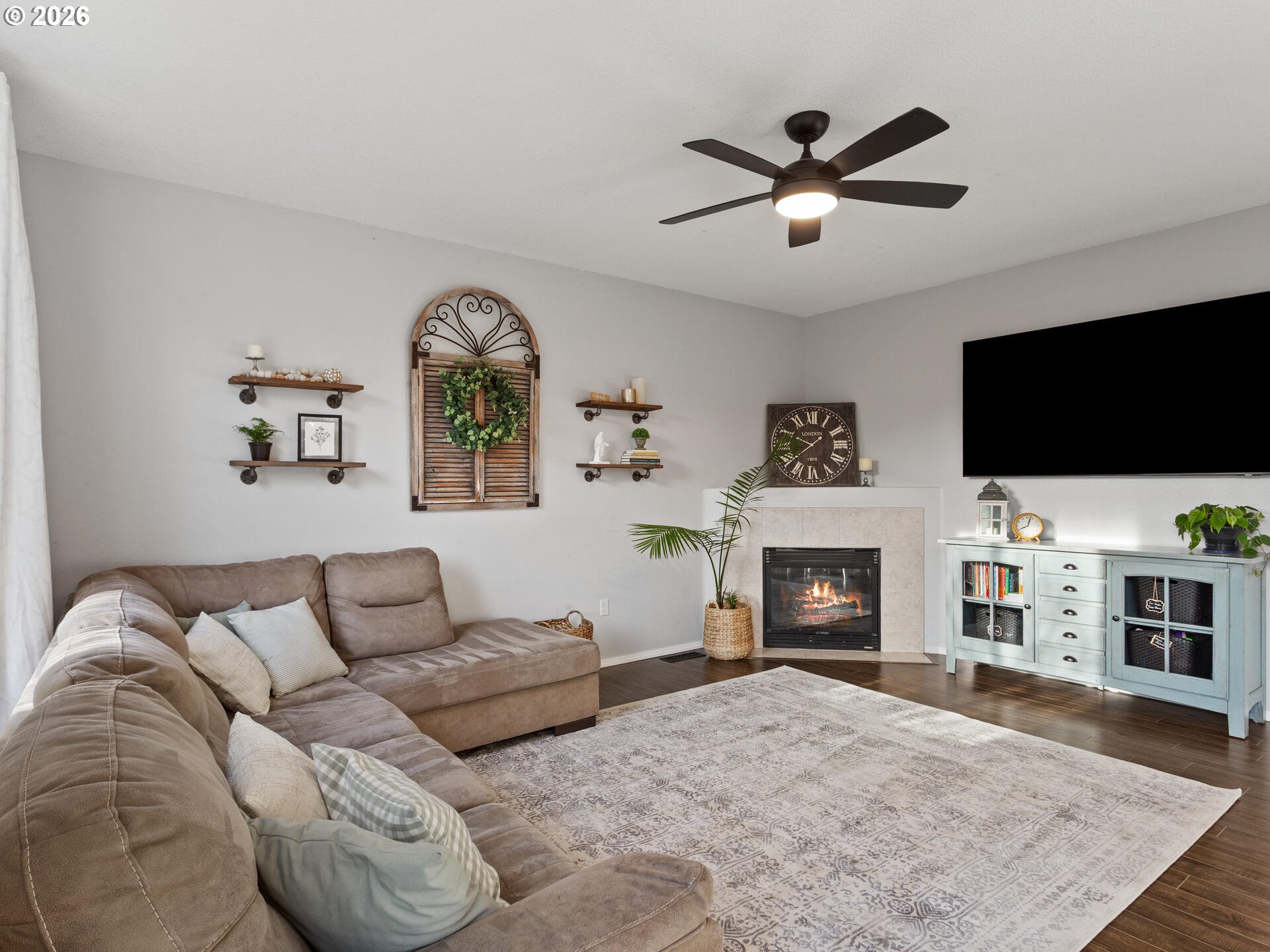 5468 J Street Washougal, WA 98671 - Photo 12 of 48 a living room with furniture and a flat screen tv
