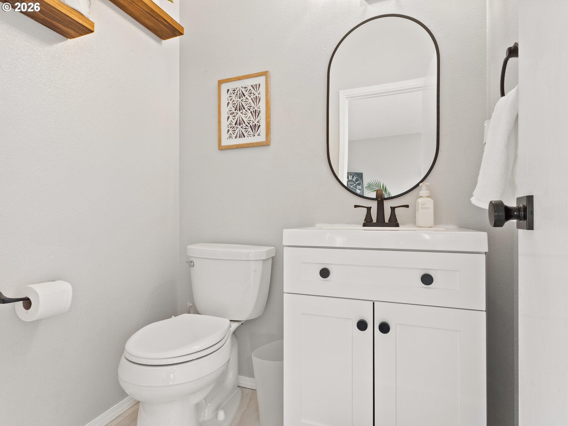 5468 J Street Washougal, WA 98671 - Photo 15 of 48 a bathroom with a toilet a sink and a mirror