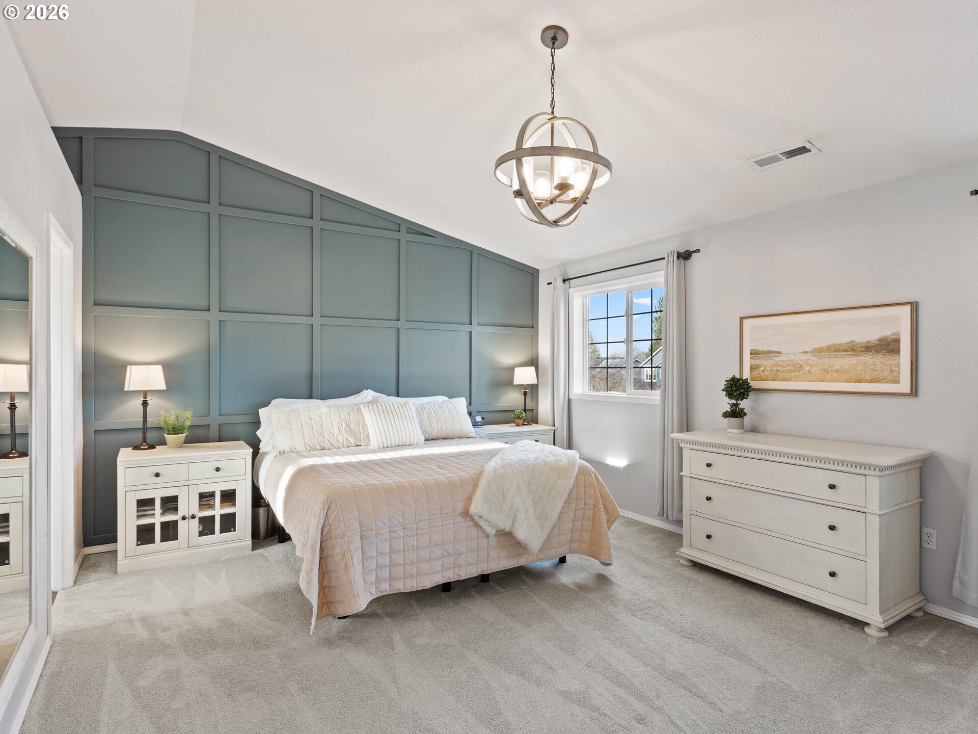 5468 J Street Washougal, WA 98671 - Photo 16 of 48 a bedroom with a large bed and a chandelier