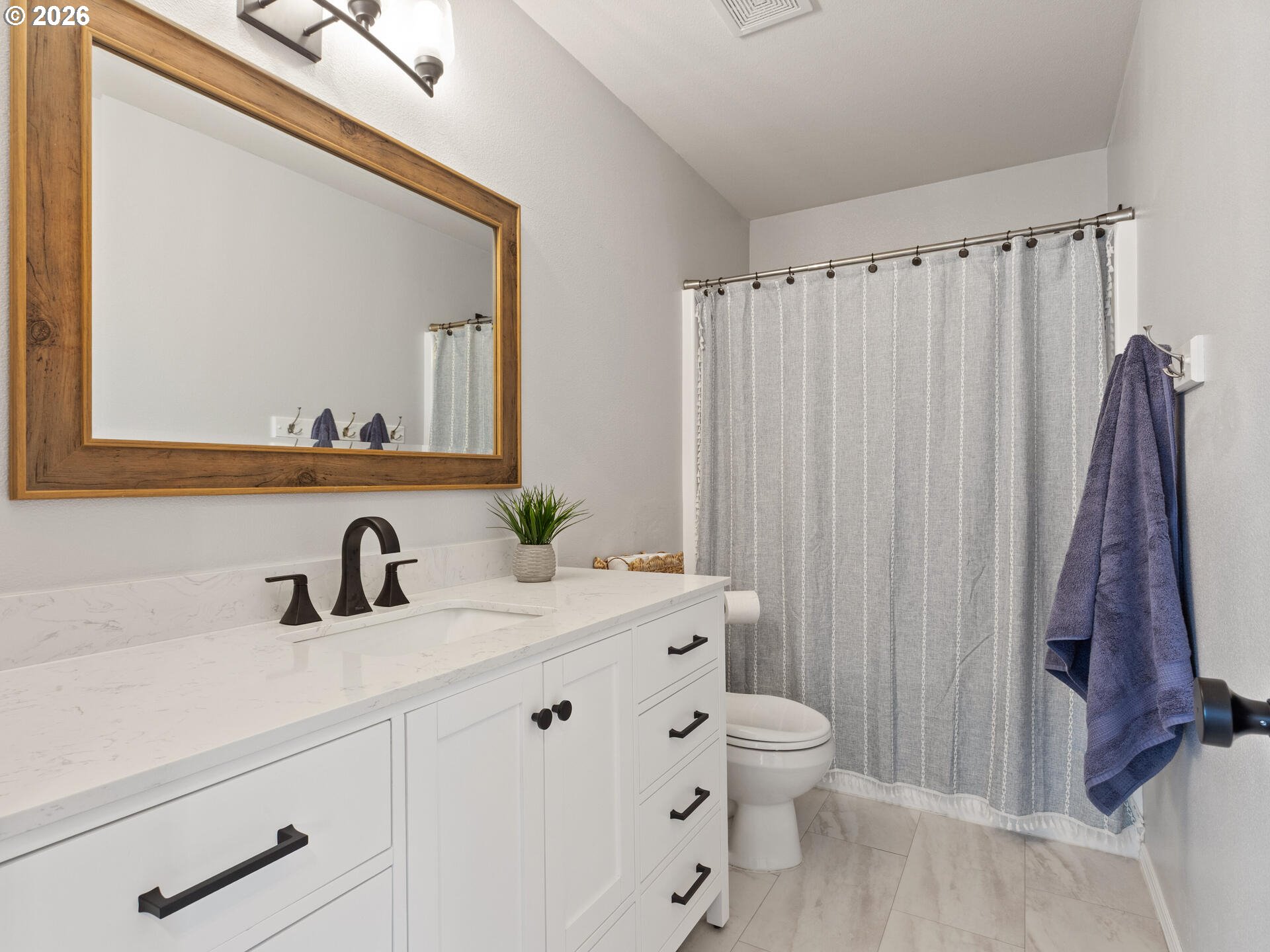 5468 J Street Washougal, WA 98671 - Photo 24 of 48 a bathroom with a sink a toilet and a mirror