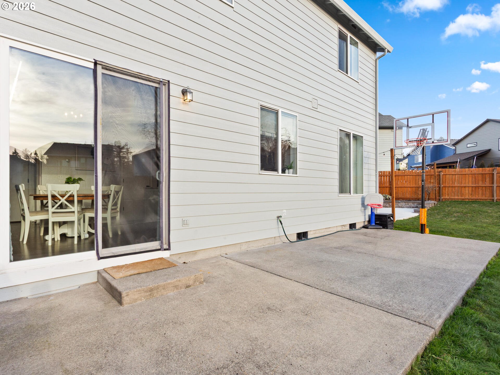 5468 J Street Washougal, WA 98671 - Photo 27 of 48 a view of a house with a backyard and a garage