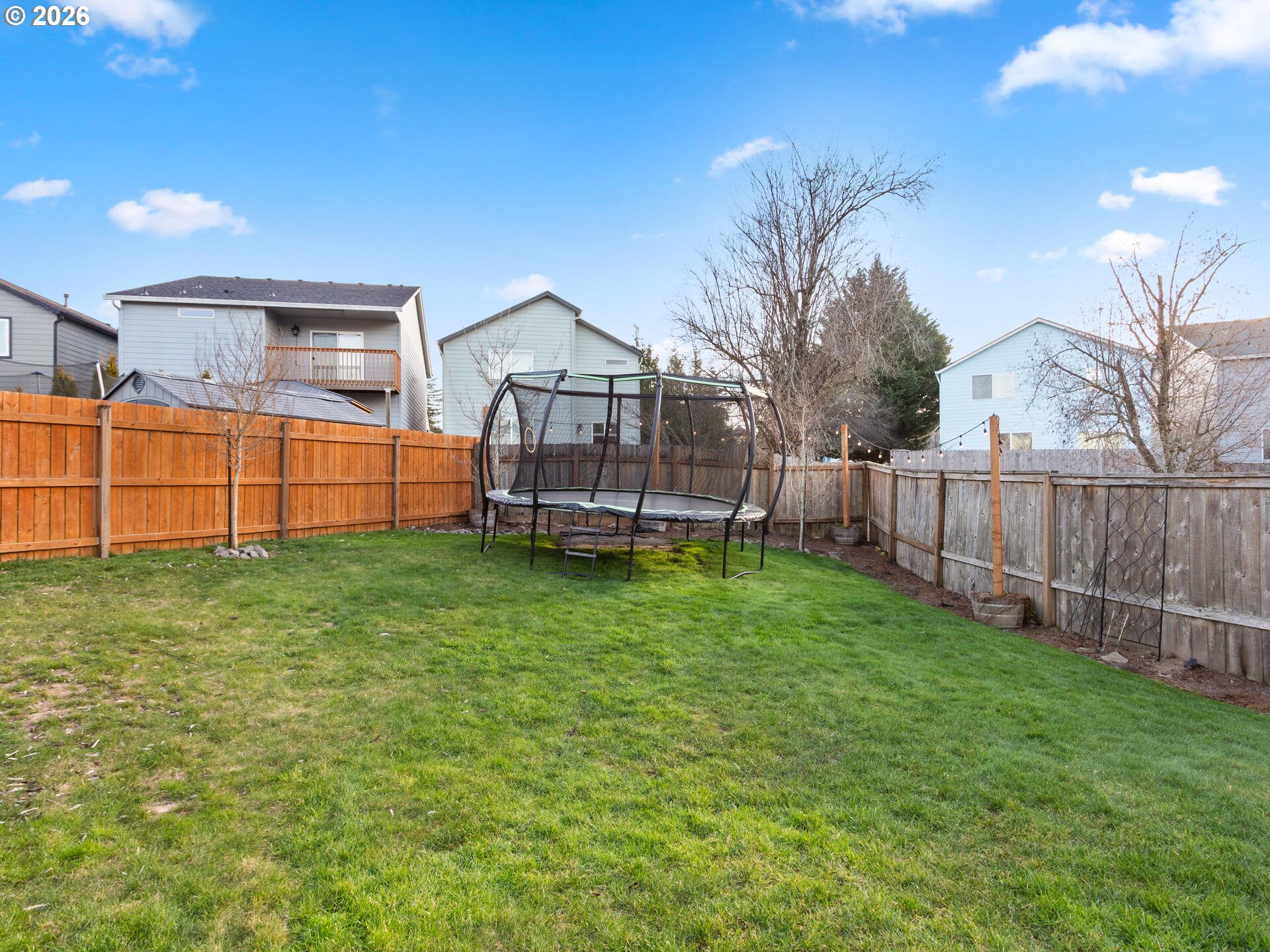 5468 J Street Washougal, WA 98671 - Photo 31 of 48 a view of a house with backyard and a garden