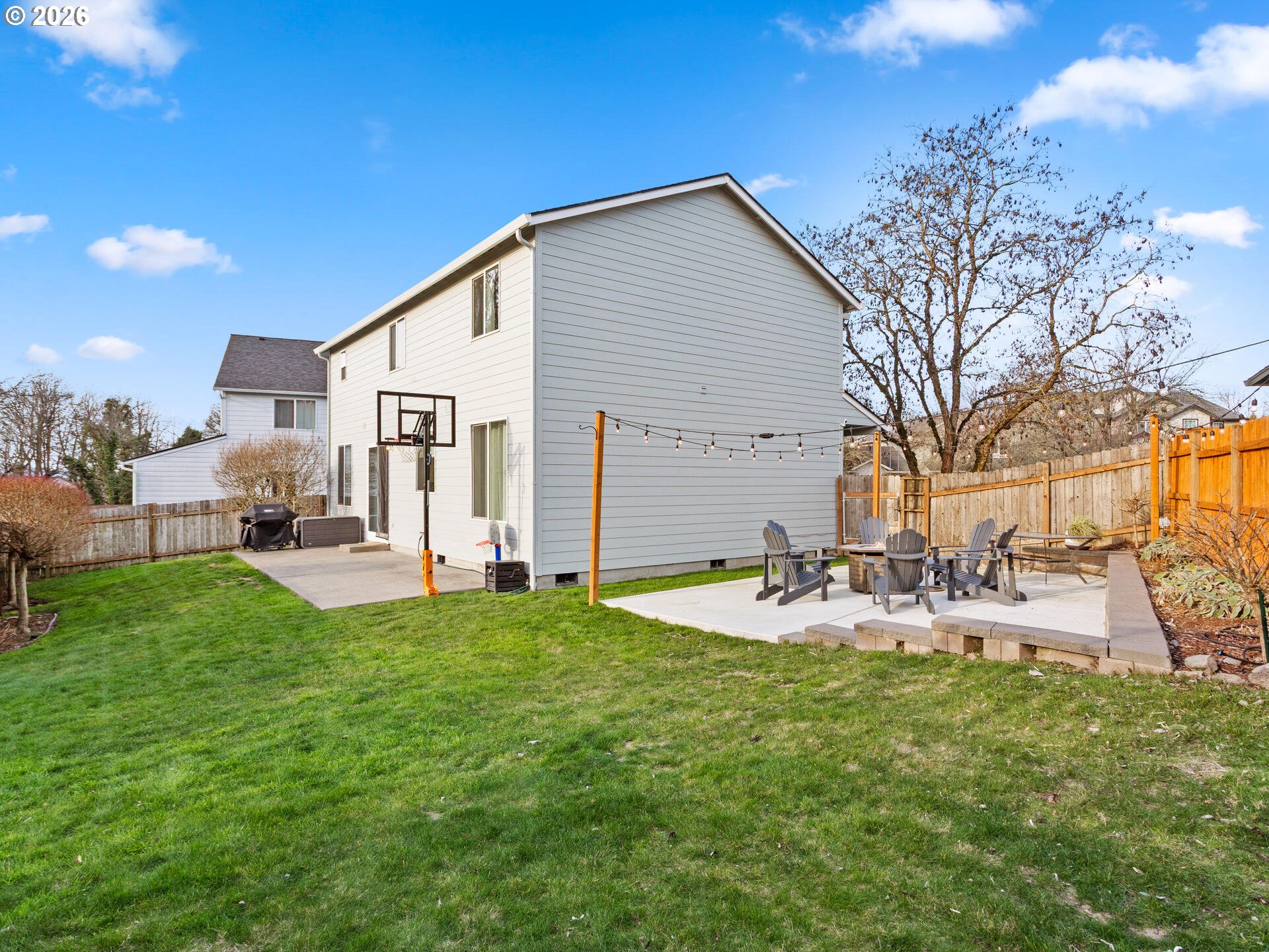 5468 J Street Washougal, WA 98671 - Photo 32 of 48 a view of a house with backyard and sitting area