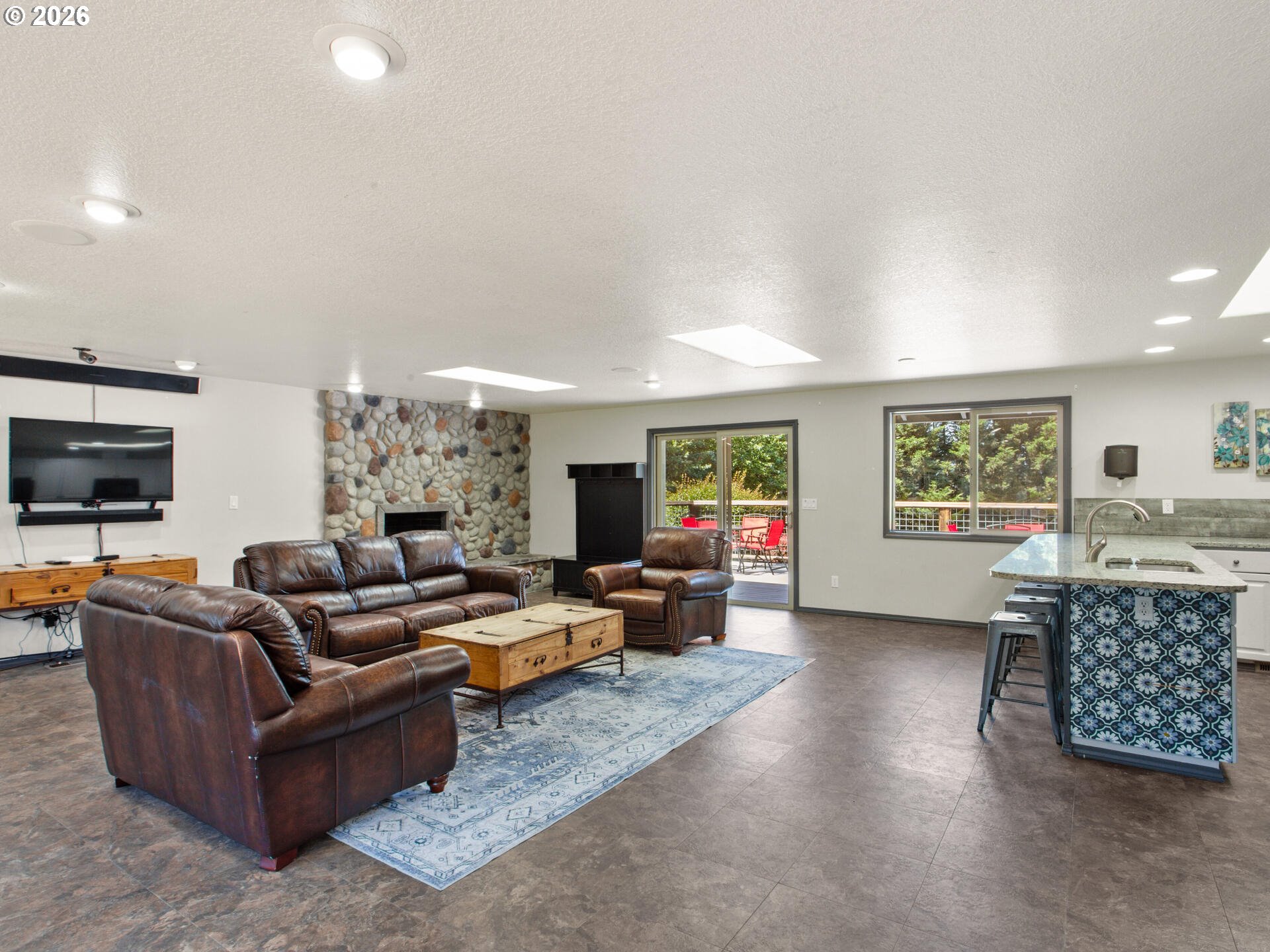5468 J Street Washougal, WA 98671 - Photo 37 of 48 a living room with furniture large window and flat screen tv