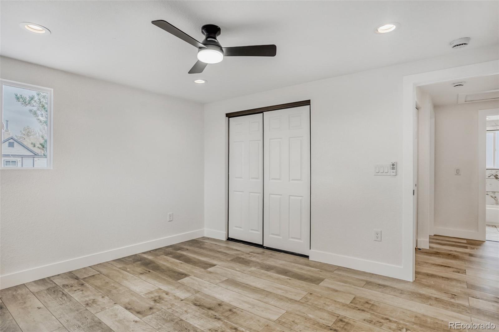 1057 Meade Street Denver, CO 80204 - Photo 14 of 38 wooden floor in an empty room