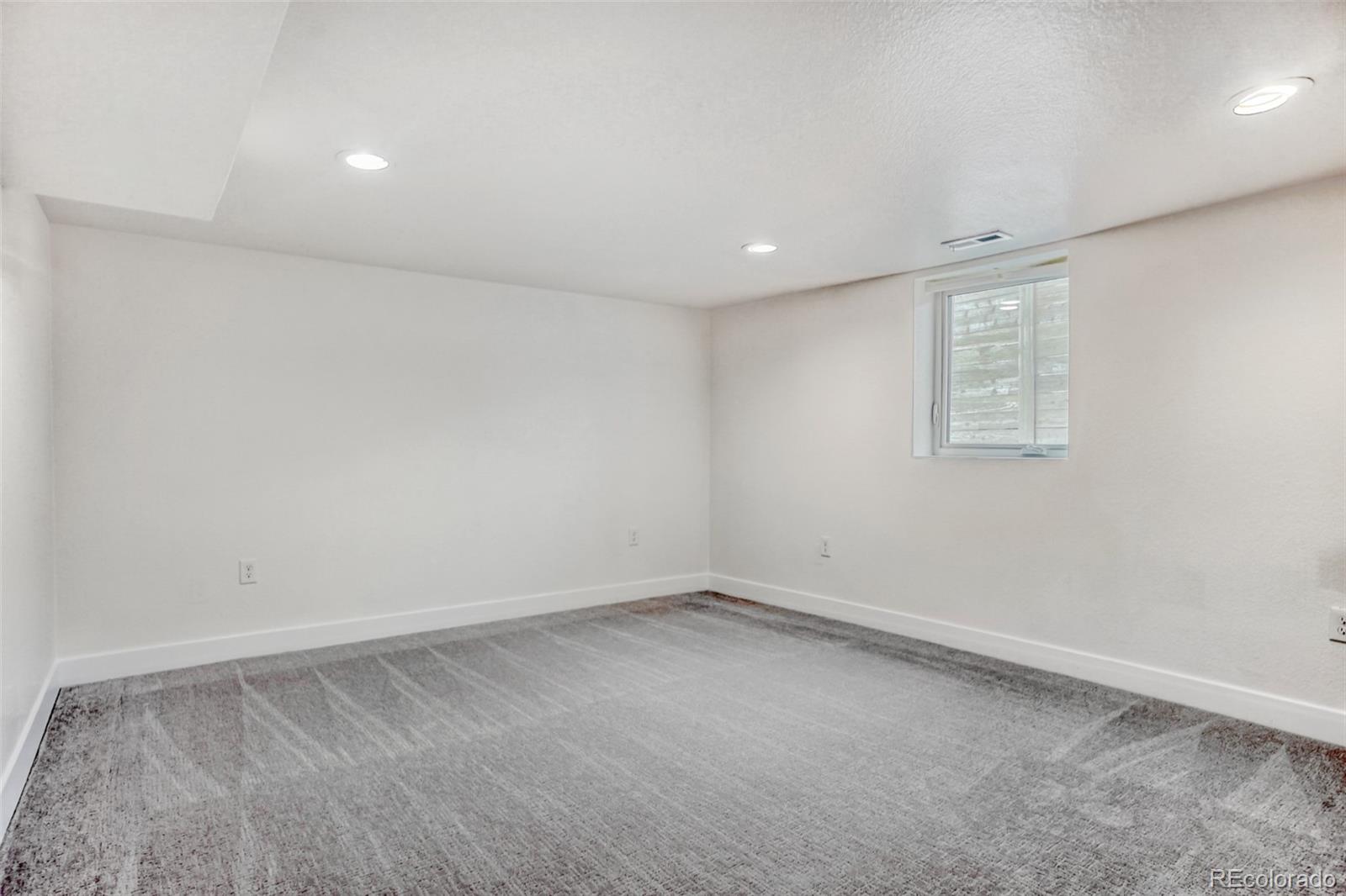 1057 Meade Street Denver, CO 80204 - Photo 17 of 38 an empty room with a window