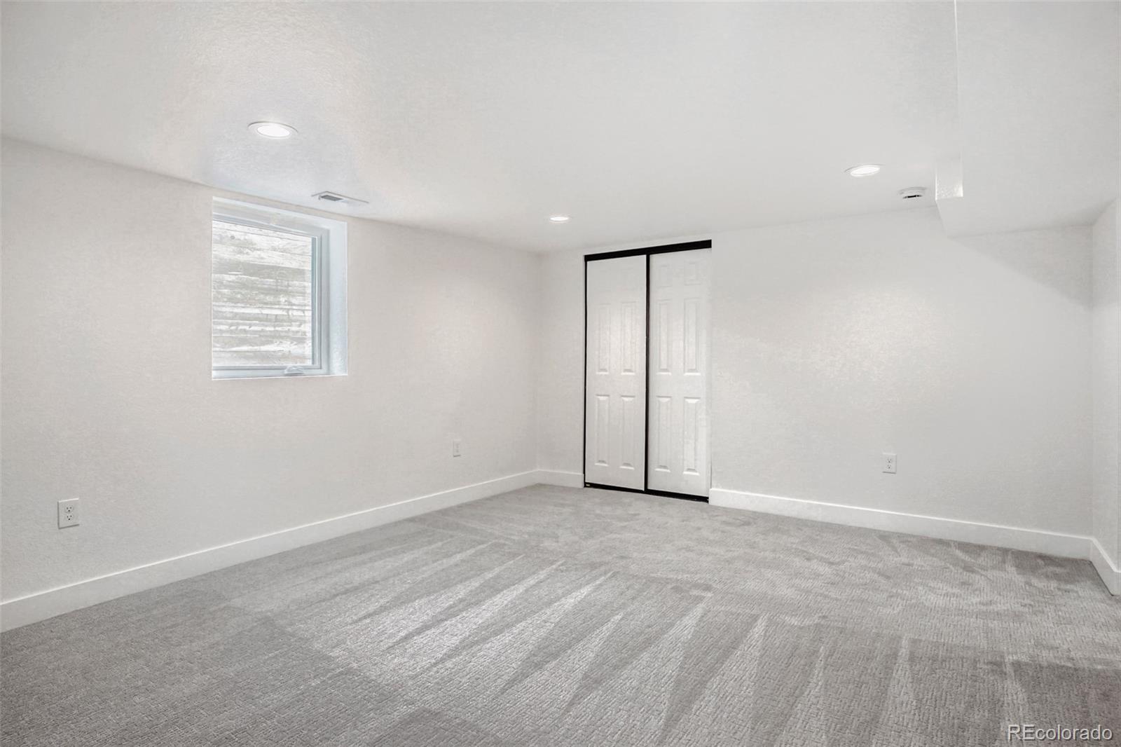 1057 Meade Street Denver, CO 80204 - Photo 18 of 38 wooden floor in an empty room with a window