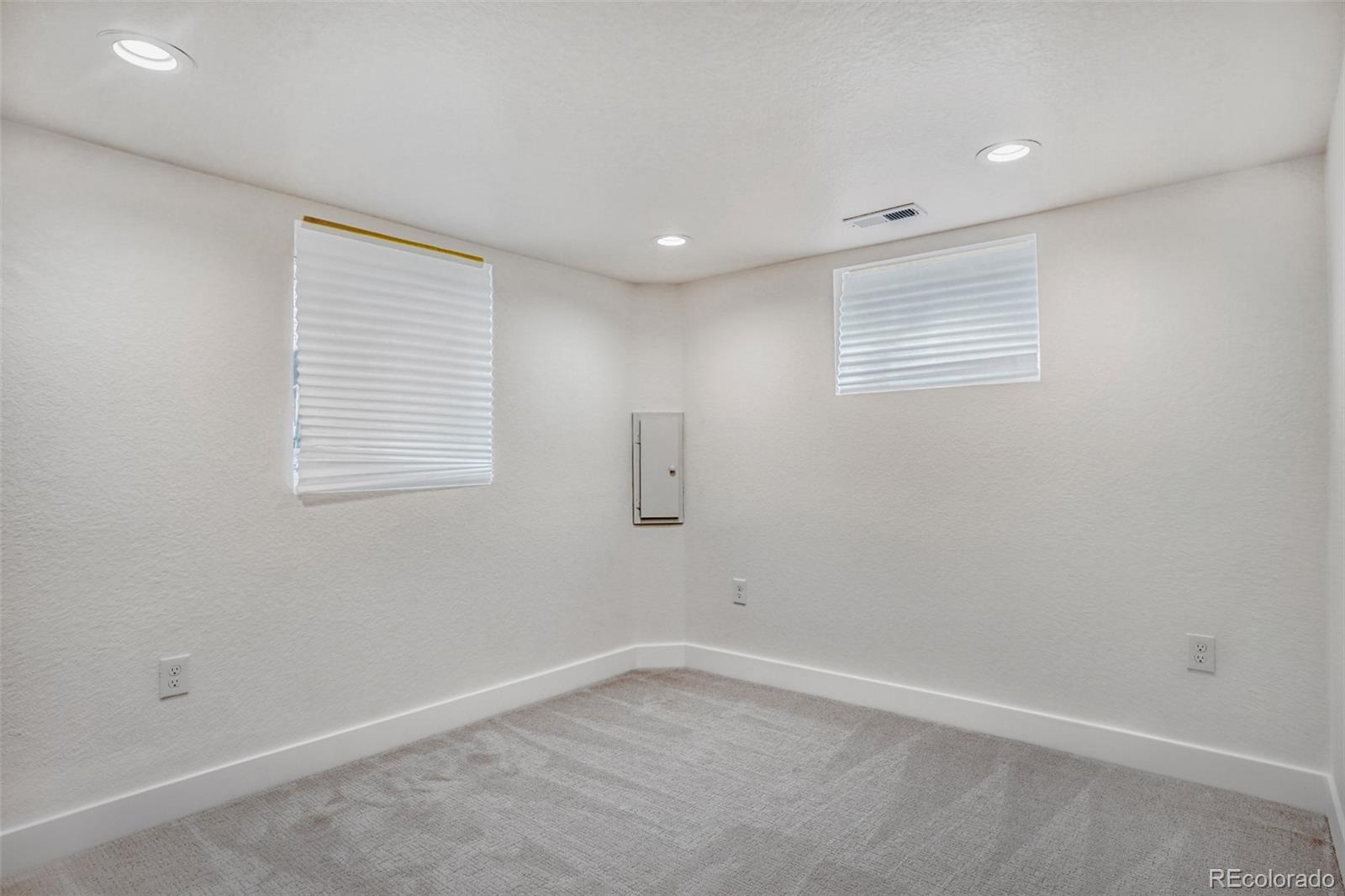 1057 Meade Street Denver, CO 80204 - Photo 19 of 38 an empty room with a window