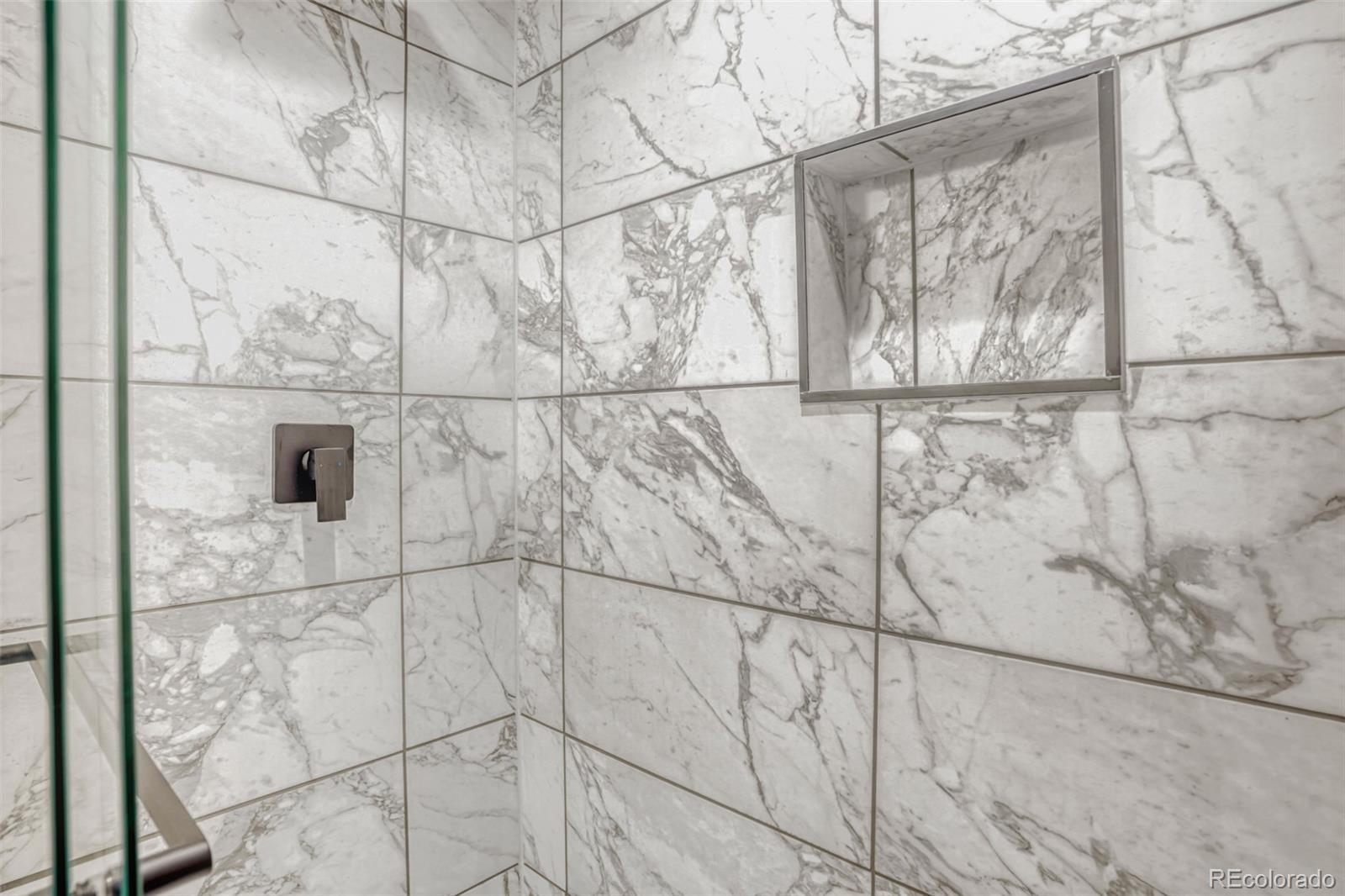 1057 Meade Street Denver, CO 80204 - Photo 22 of 38 a bathroom with a shower