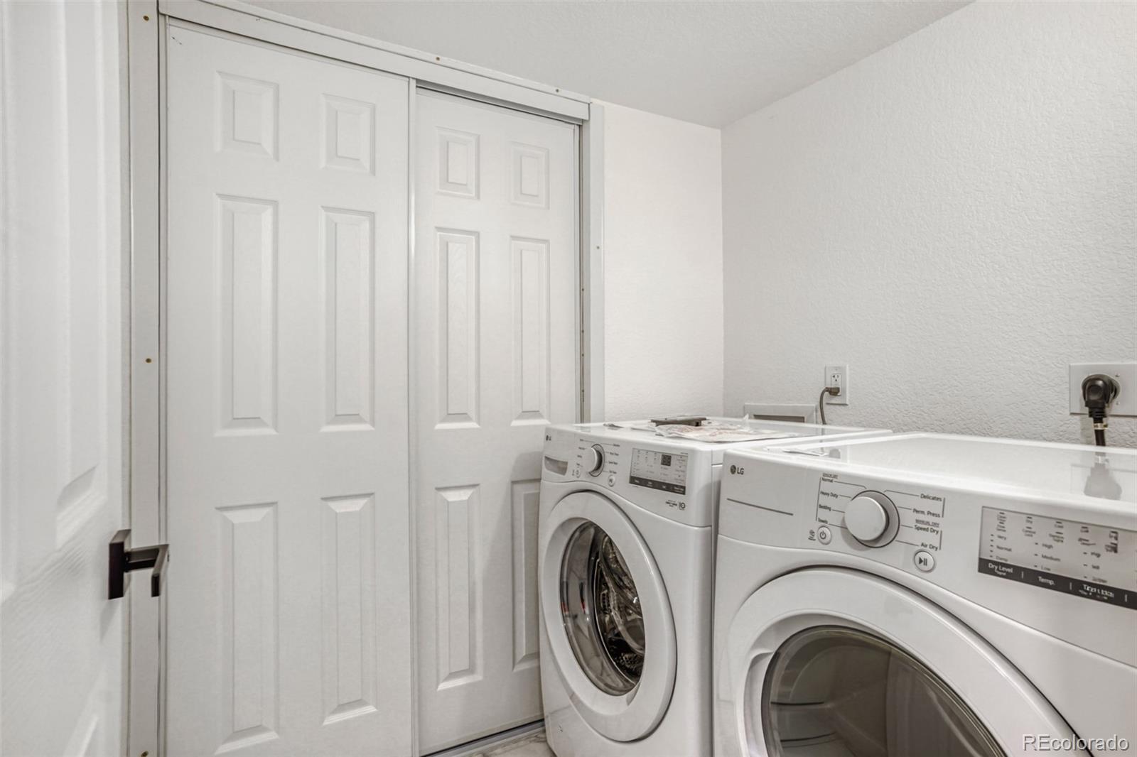 1057 Meade Street Denver, CO 80204 - Photo 24 of 38 a utility room with dryer and washer
