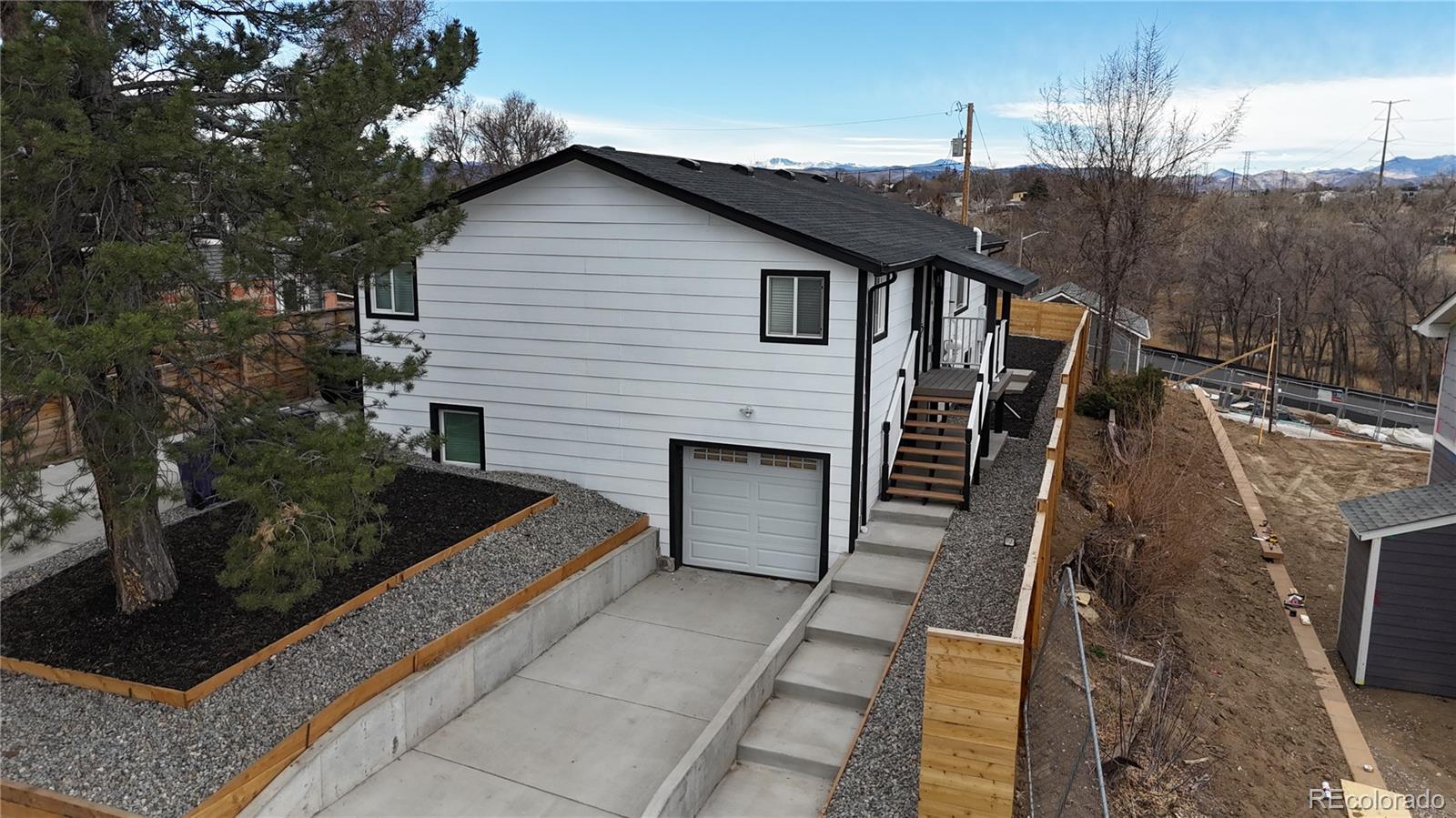 1057 Meade Street Denver, CO 80204 - Photo 28 of 38 a view of a house with backyard and deck