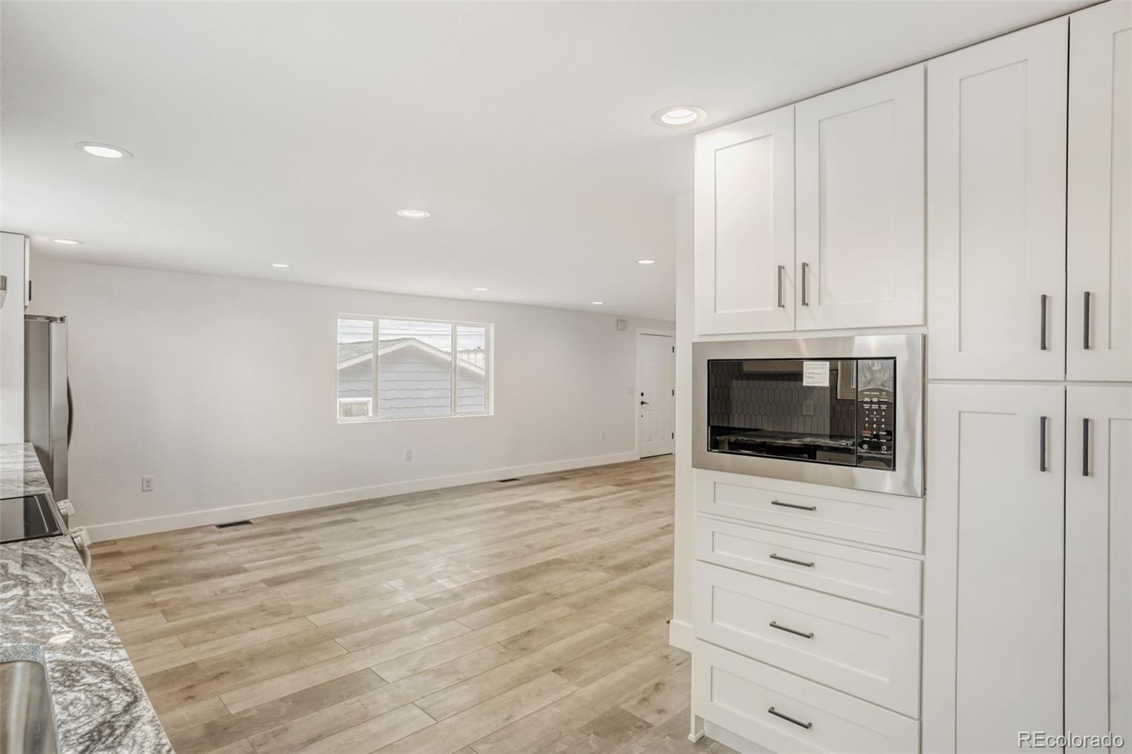 1057 Meade Street Denver, CO 80204 - Photo 6 of 38 a view of a kitchen with an oven