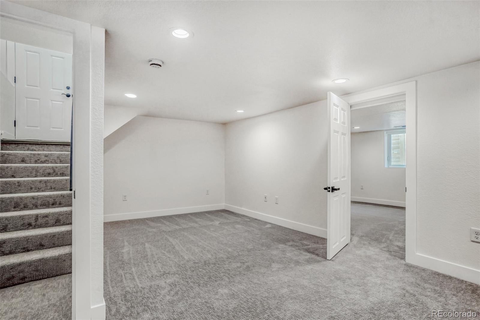 1057 Meade Street Denver, CO 80204 - Photo 10 of 38 a view of an empty room with a window