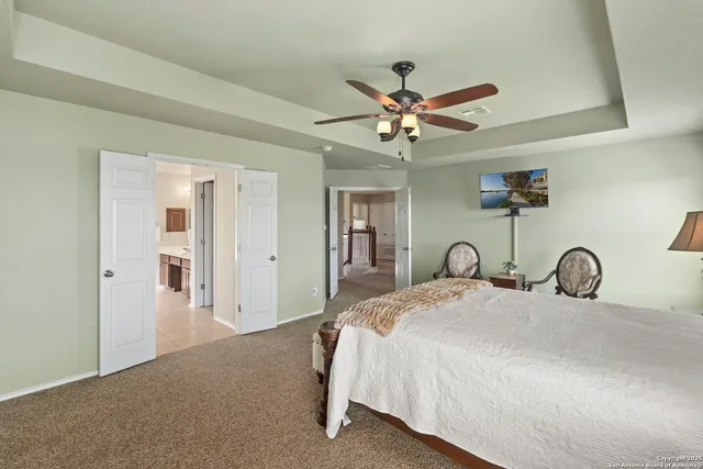 a bedroom with a bed and a mirror