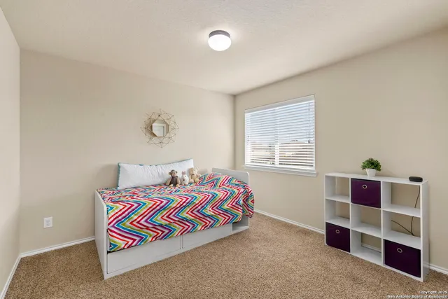 a room with a bed and window