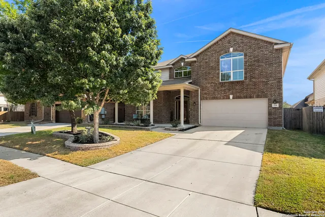 a front view of a house with garage