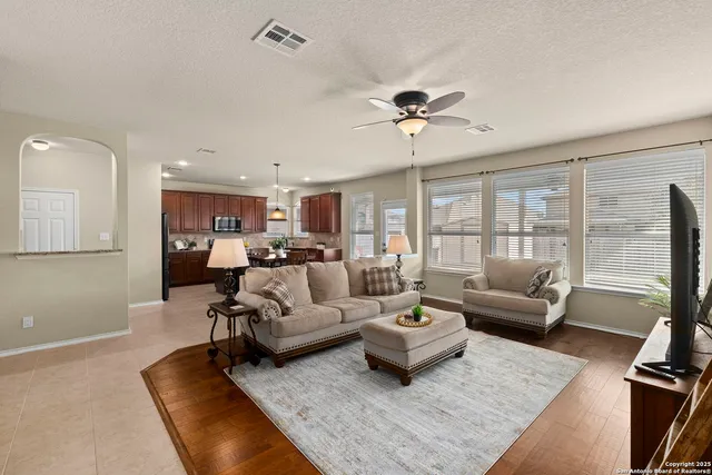 a living room with furniture and a large window