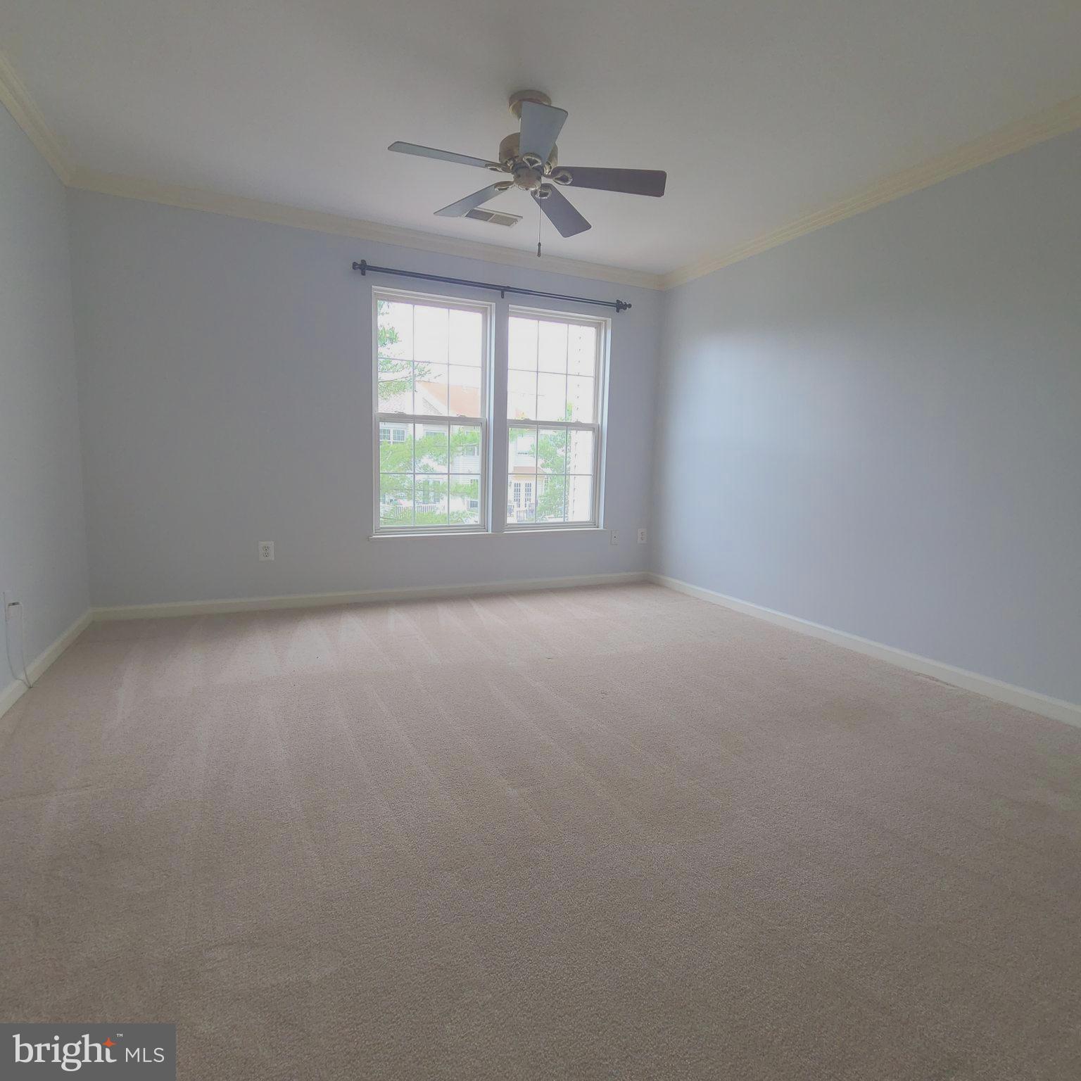 43393 Chokeberry Square Ashburn, VA 20147 - Photo 14 of 31 an empty room with a window and a fan