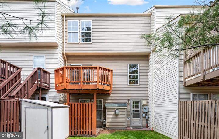 43393 Chokeberry Square Ashburn, VA 20147 - Photo 27 of 31 a front view of a house with a garden