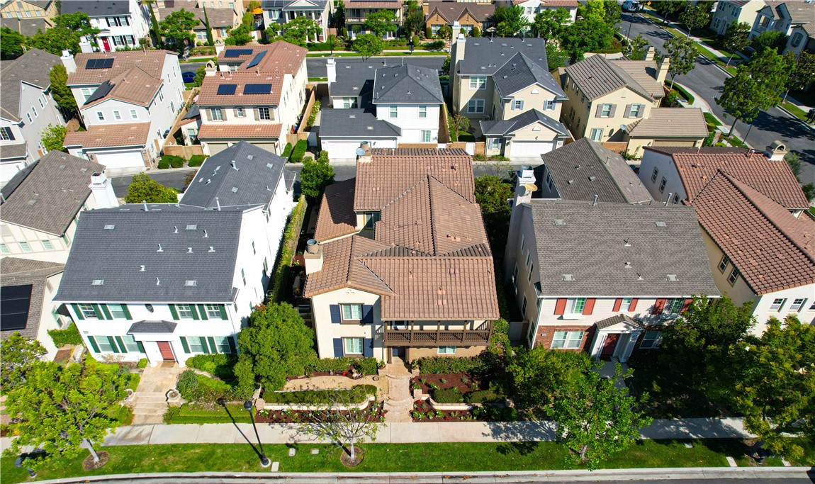 15205 Columbus Square Tustin, CA 92782 - Photo 3 of 43 an aerial view of multiple houses with a yard