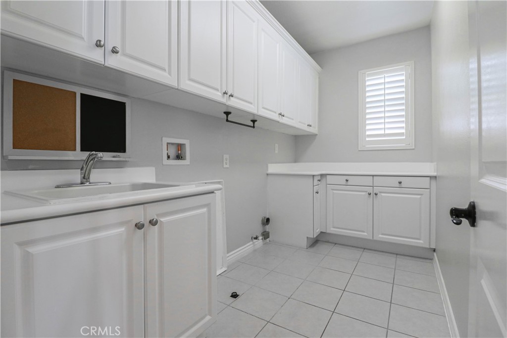 15205 Columbus Square Tustin, CA 92782 - Photo 34 of 43 a spacious bathroom with a sink a vanity and a mirror