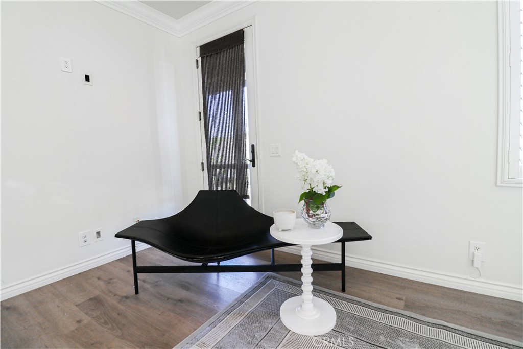15205 Columbus Square Tustin, CA 92782 - Photo 37 of 43 a living room with furniture and a chair