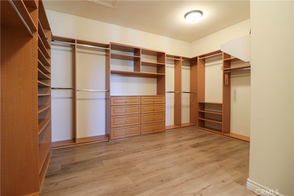 15205 Columbus Square Tustin, CA 92782 - Photo 41 of 43 a view of walk in closet with empty racks