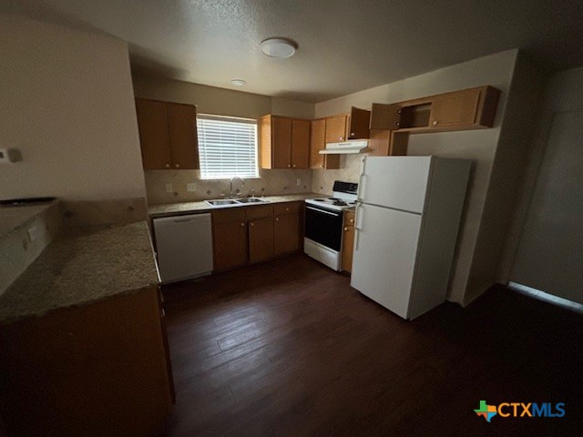 4411 Abigail Drive Killeen, TX 76549 - Photo 3 of 17 a kitchen with stainless steel appliances granite countertop a refrigerator a stove a sink and a microwave oven with wooden floor
