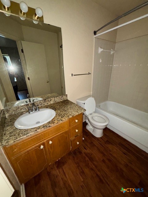 4411 Abigail Drive Killeen, TX 76549 - Photo 6 of 17 a bathroom with a granite countertop sink a toilet and a mirror