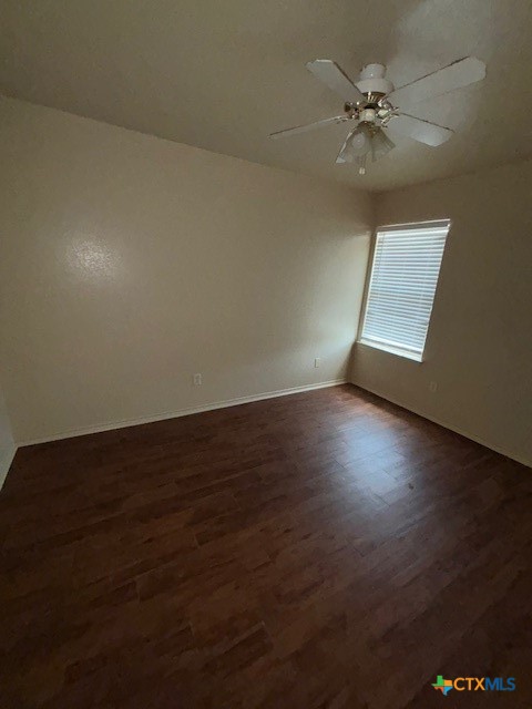 4411 Abigail Drive Killeen, TX 76549 - Photo 10 of 17 a view of an empty room with wooden floor and a window