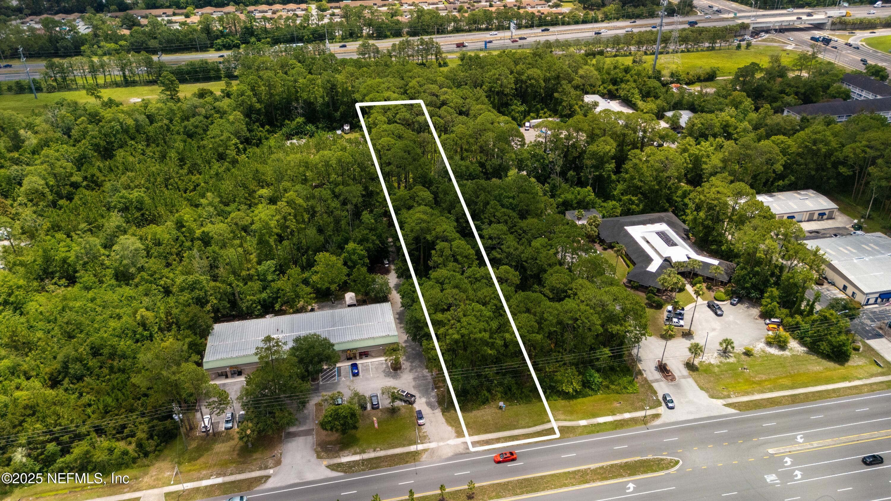 0 St Johns Bluff Road North Jacksonville, FL 32246 - Photo 9 of 12 an aerial view of a house with a garden