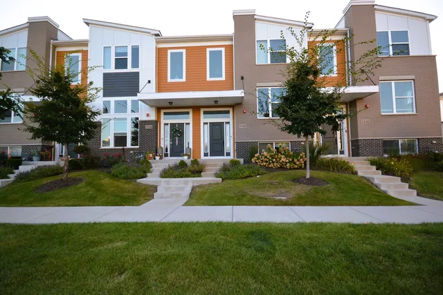 a front view of a house with a yard