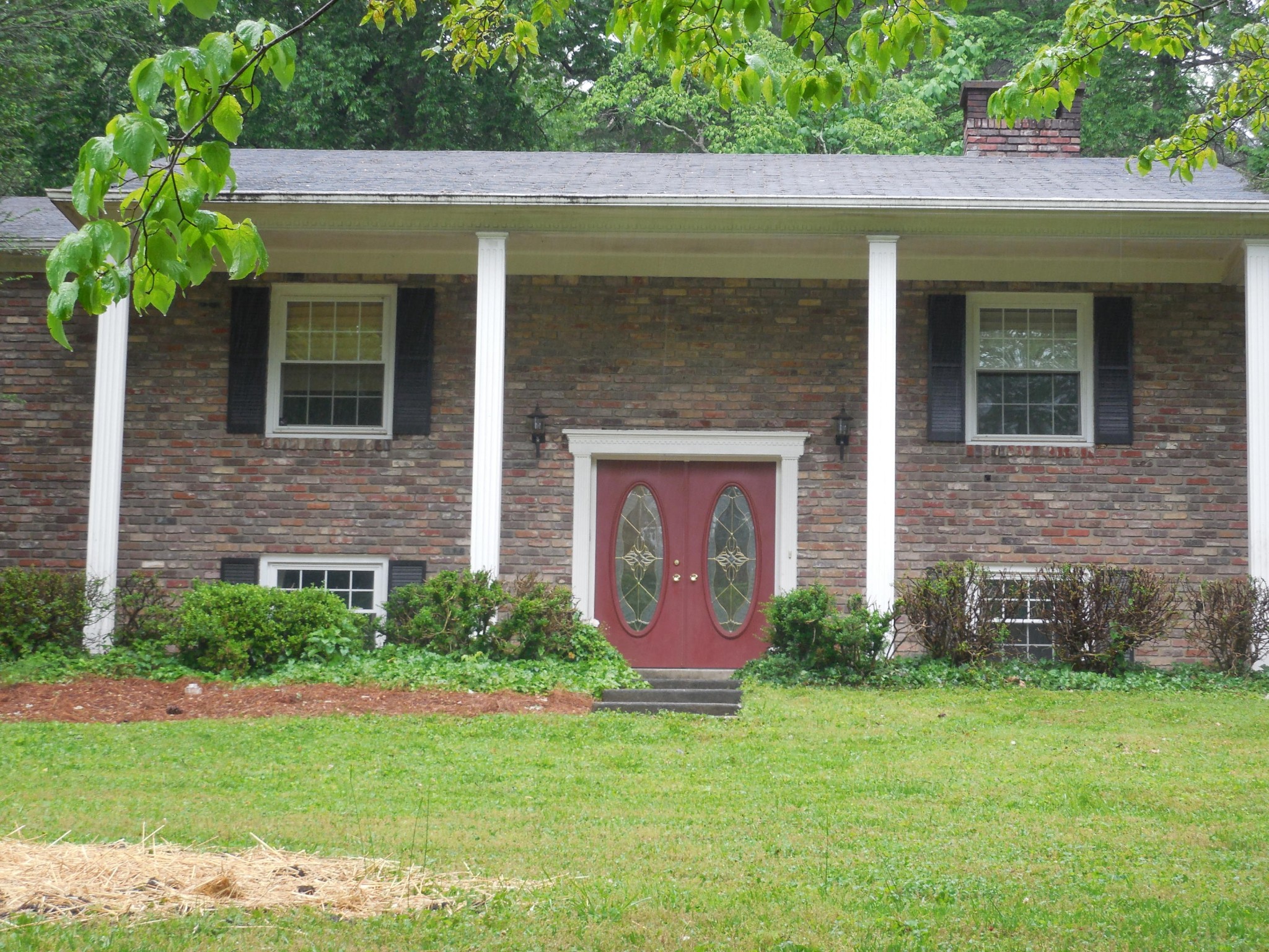 104 Windham Road Oak Ridge, TN 37830 - Photo 1 of 17 a front view of a house with garden