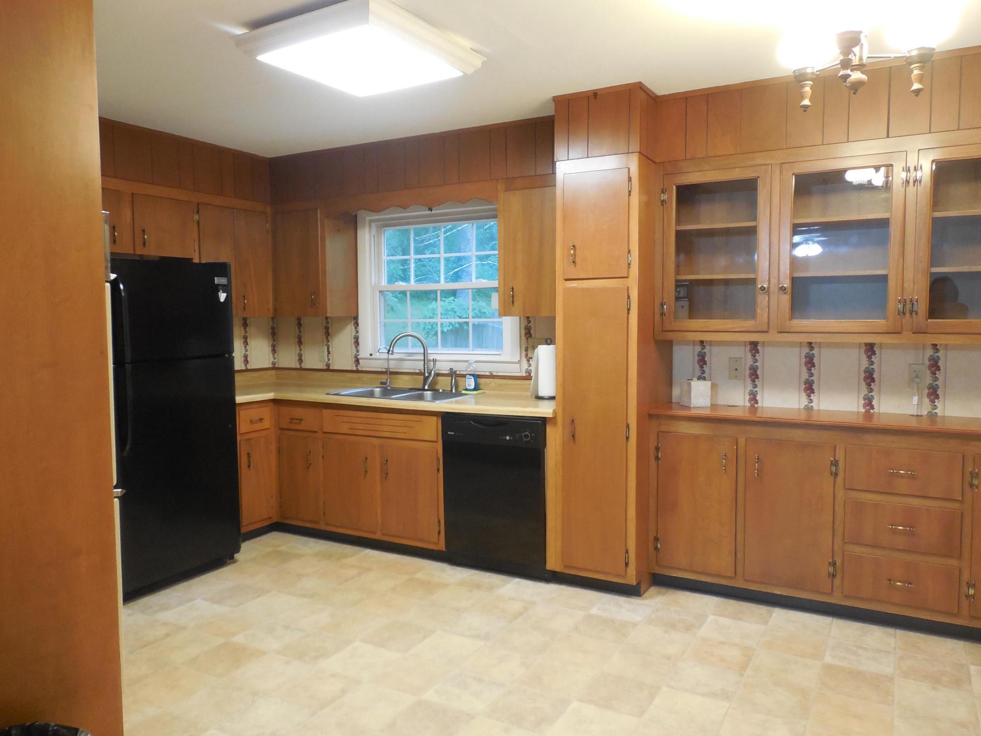 104 Windham Road Oak Ridge, TN 37830 - Photo 6 of 17 a kitchen with stainless steel appliances a refrigerator sink and cabinets