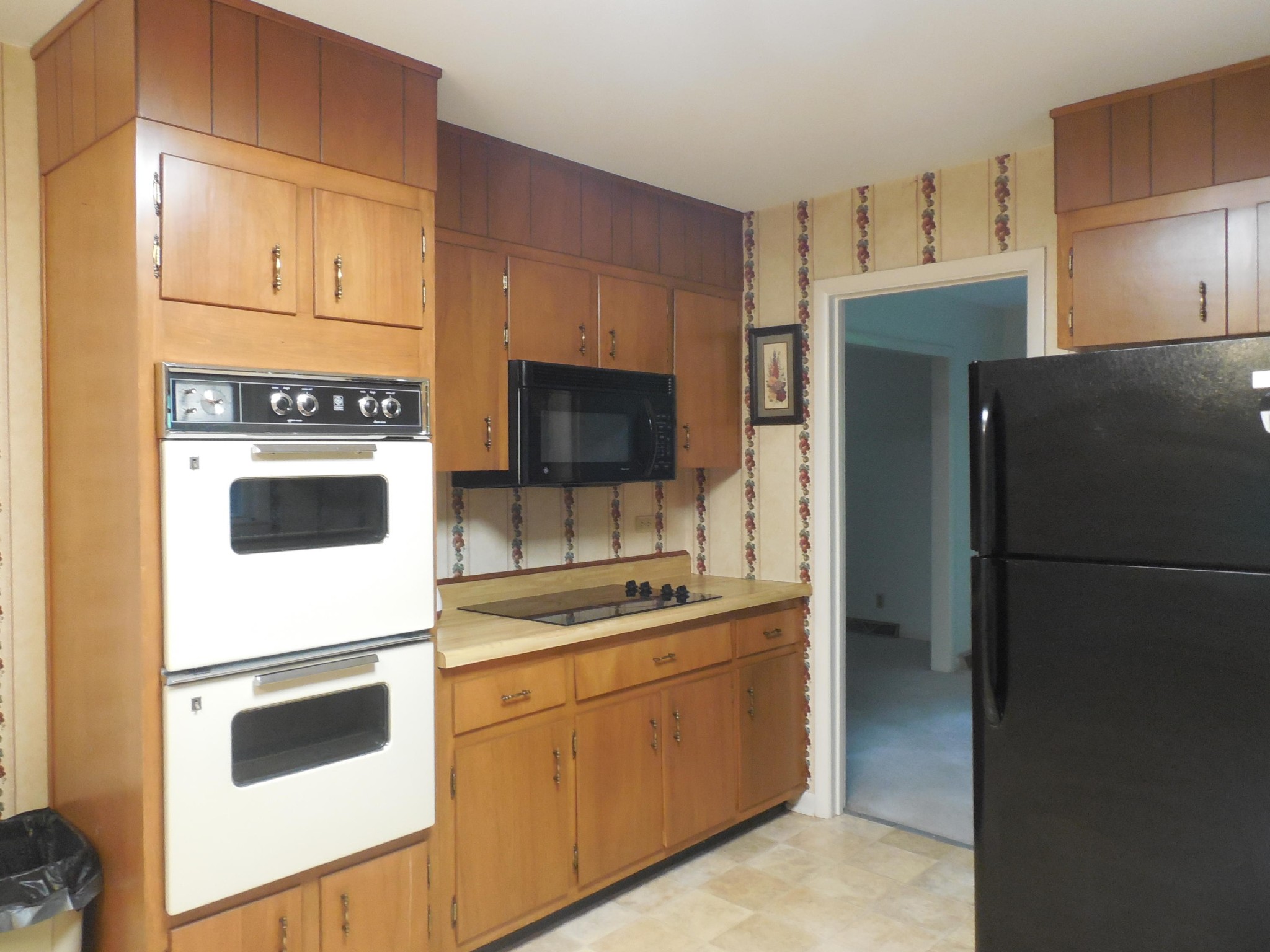 104 Windham Road Oak Ridge, TN 37830 - Photo 8 of 17 a kitchen with stainless steel appliances white cabinets and a refrigerator