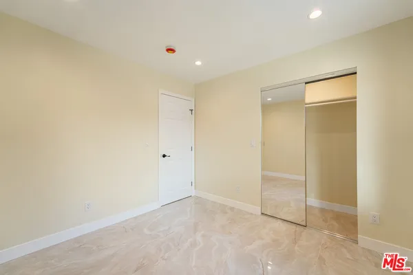 a bathroom with a shower and a toilet