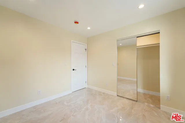 a bathroom with a shower and a toilet