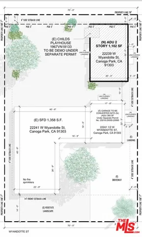 a view of a kitchen with a sink and a refrigerator