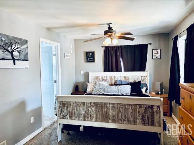 a bedroom with furniture and a window