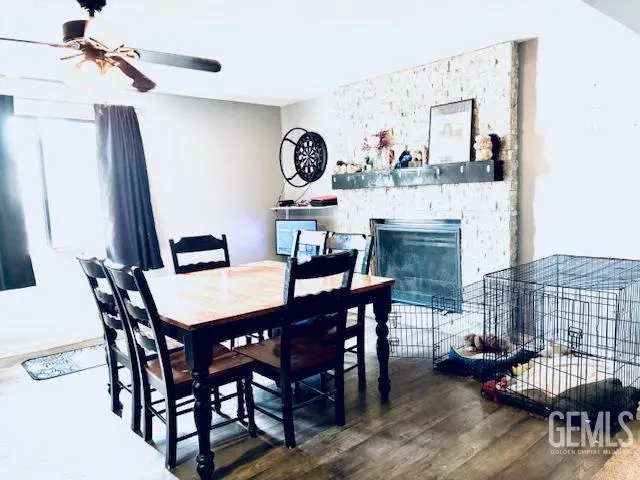 a view of a dining room with furniture and a chandelier