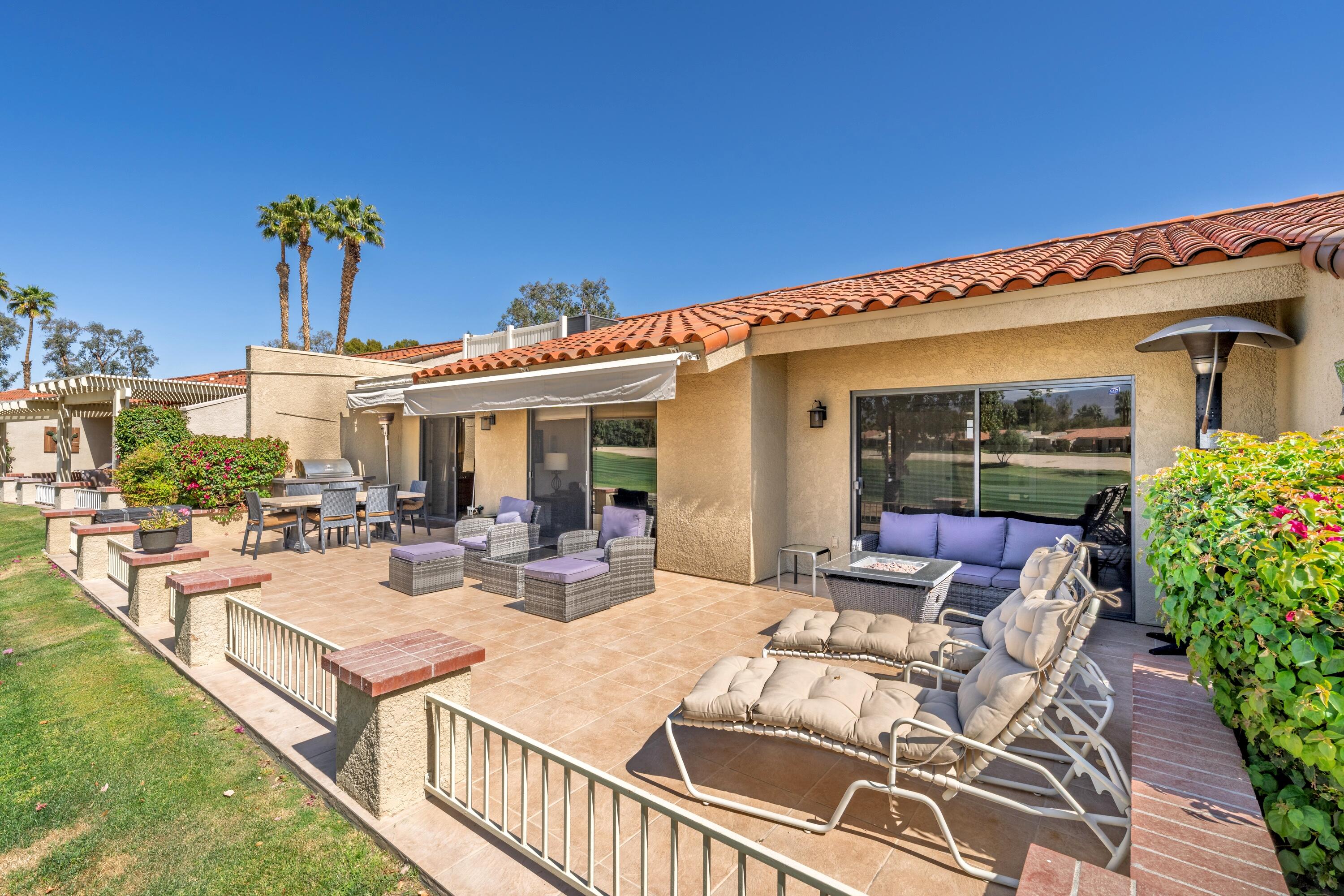 77171 Preston Trail Palm Desert, CA 92211 - Photo 1 of 31 a view of a patio with couches table and chairs and potted plants