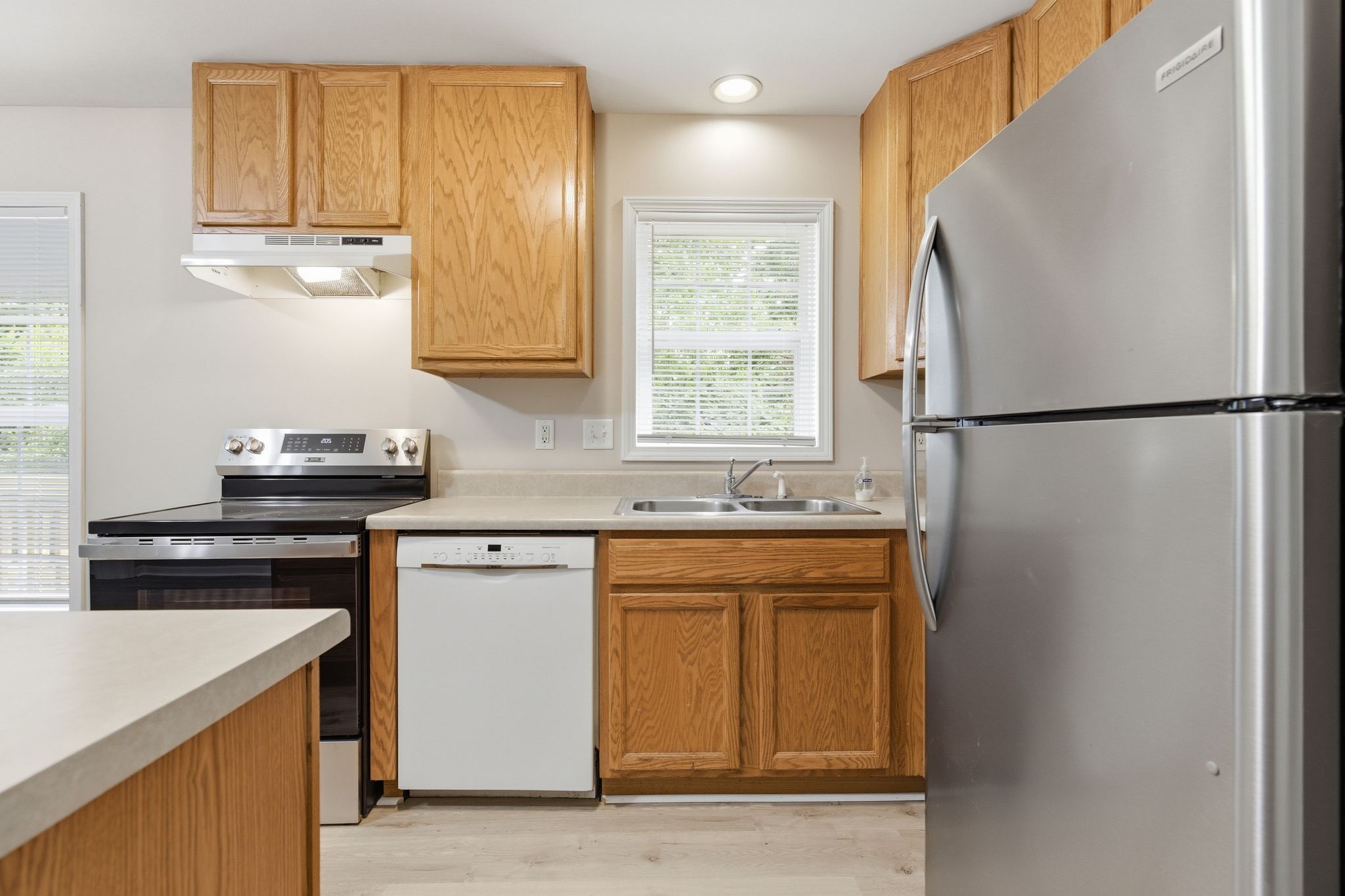 2642 Hibbitts Road Nashville, TN 37214 - Photo 15 of 29 a kitchen with a refrigerator sink and cabinets
