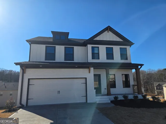 a front view of a house with yard