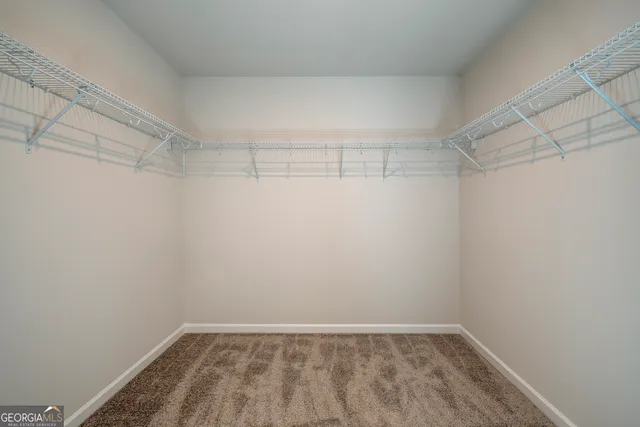 a view of a room with shelf on the wall