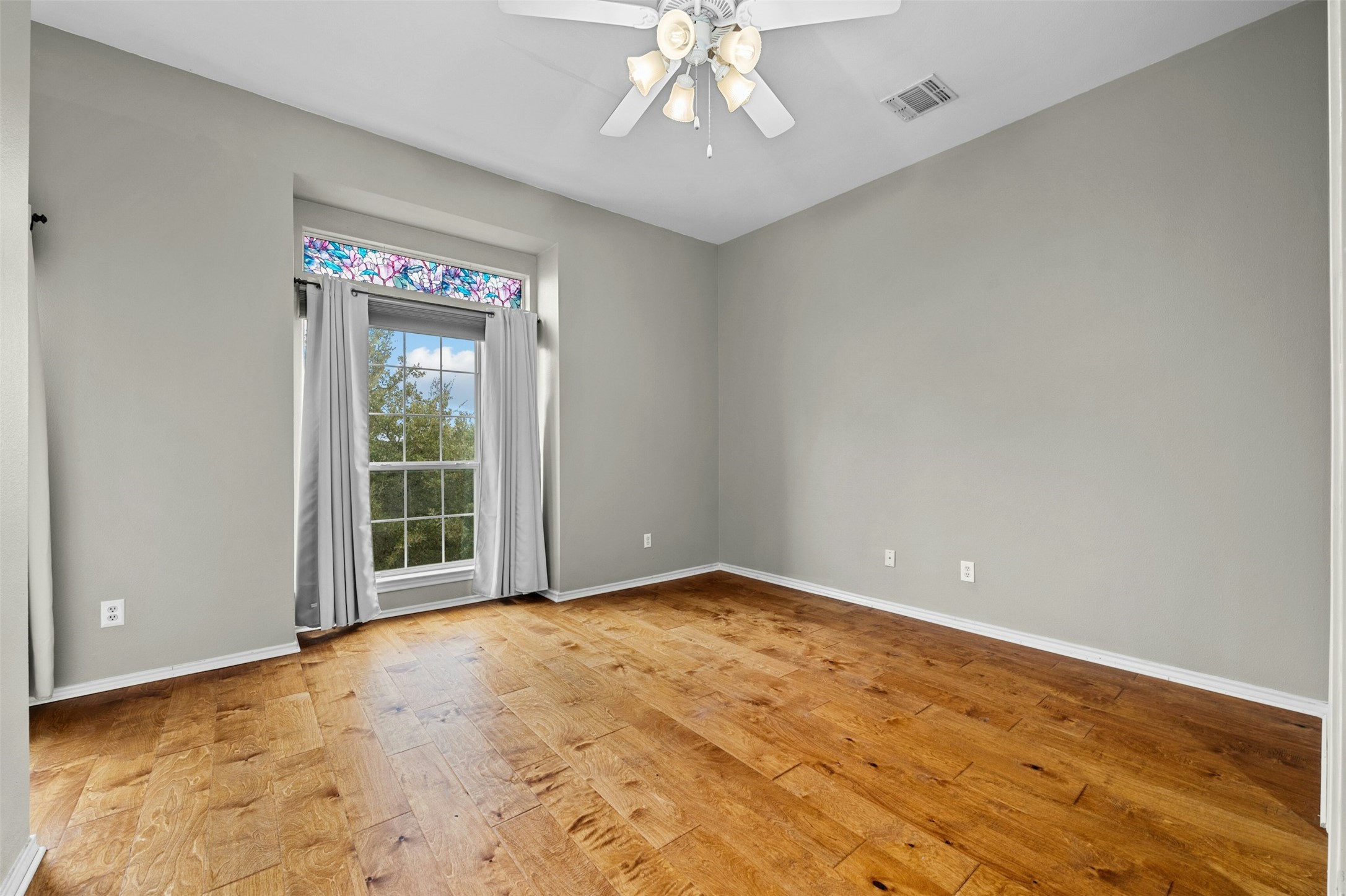2918 Ranch Road 620 North, Unit W219 Austin, TX 78734 - Photo 26 of 35 wooden floor in an empty room with a window