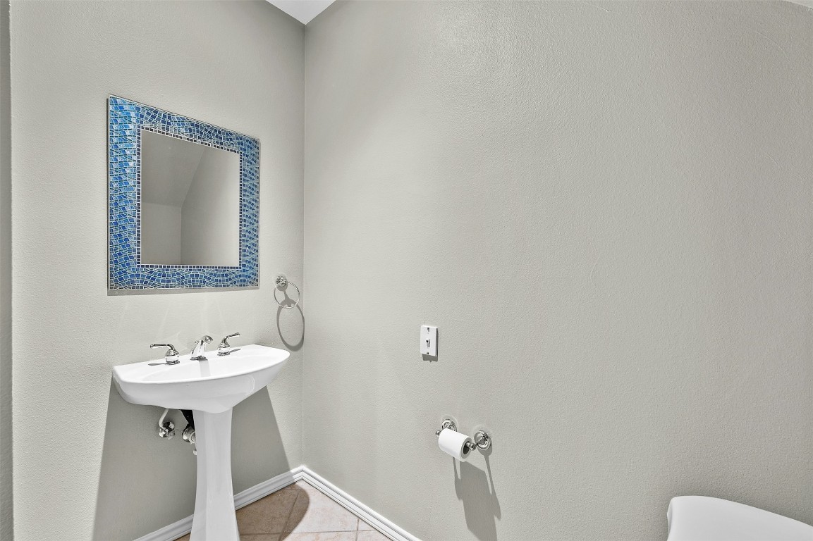 2918 Ranch Road 620 North, Unit W219 Austin, TX 78734 - Photo 30 of 35 a bathroom with a sink and a mirror