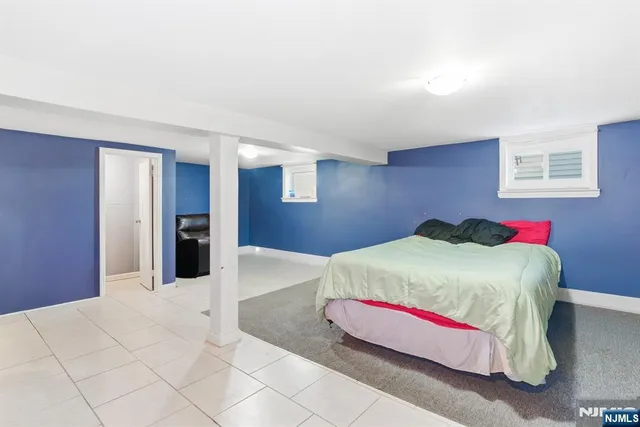 a living room with furniture and a large mirror