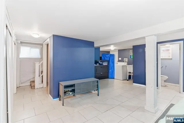 a white toilet sitting next to a bathroom sink