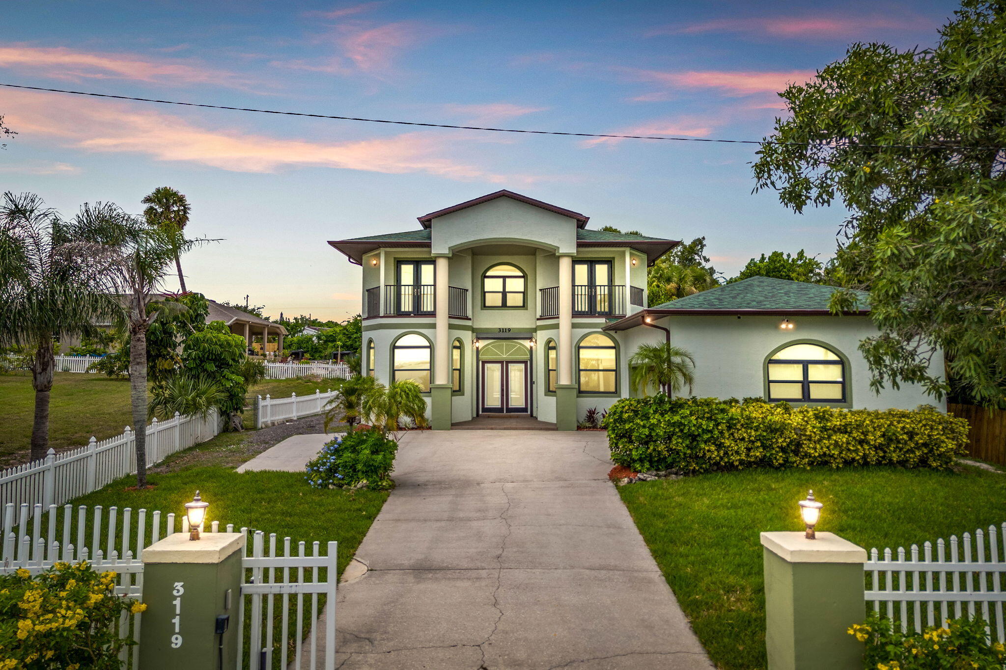 3119 Indian River Drive Cocoa, FL 32922 - Photo 1 of 47 a front view of a house with a yard and potted plants